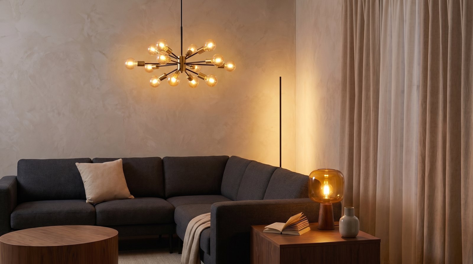 A warm brass table lamp with a linen shade in a softly lit living room